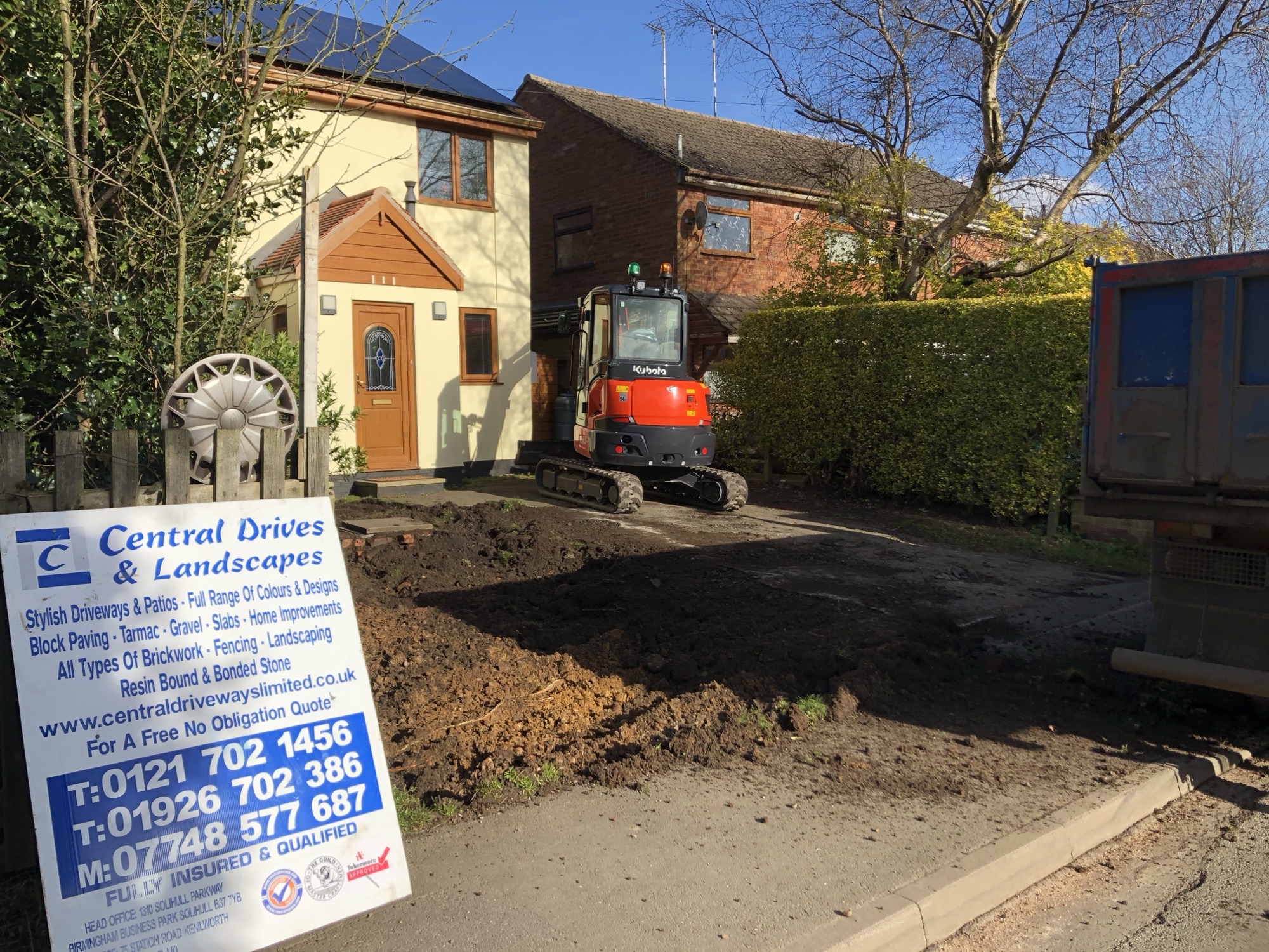 Kubota digger and Central Drives site signboard on a Solihull job